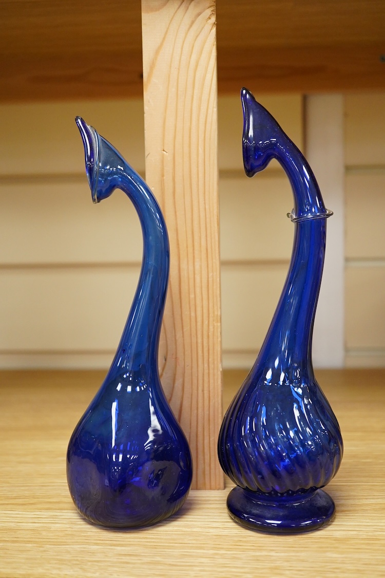 Two Persian blue glass tear catchers, largest 24cm high